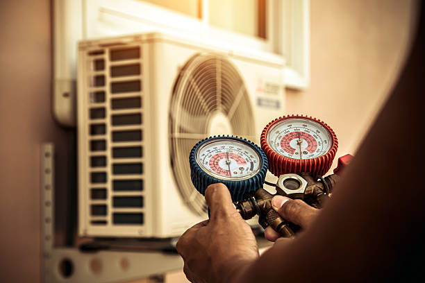 Professional Air Conditioning Service technician working in Harpersville, AL